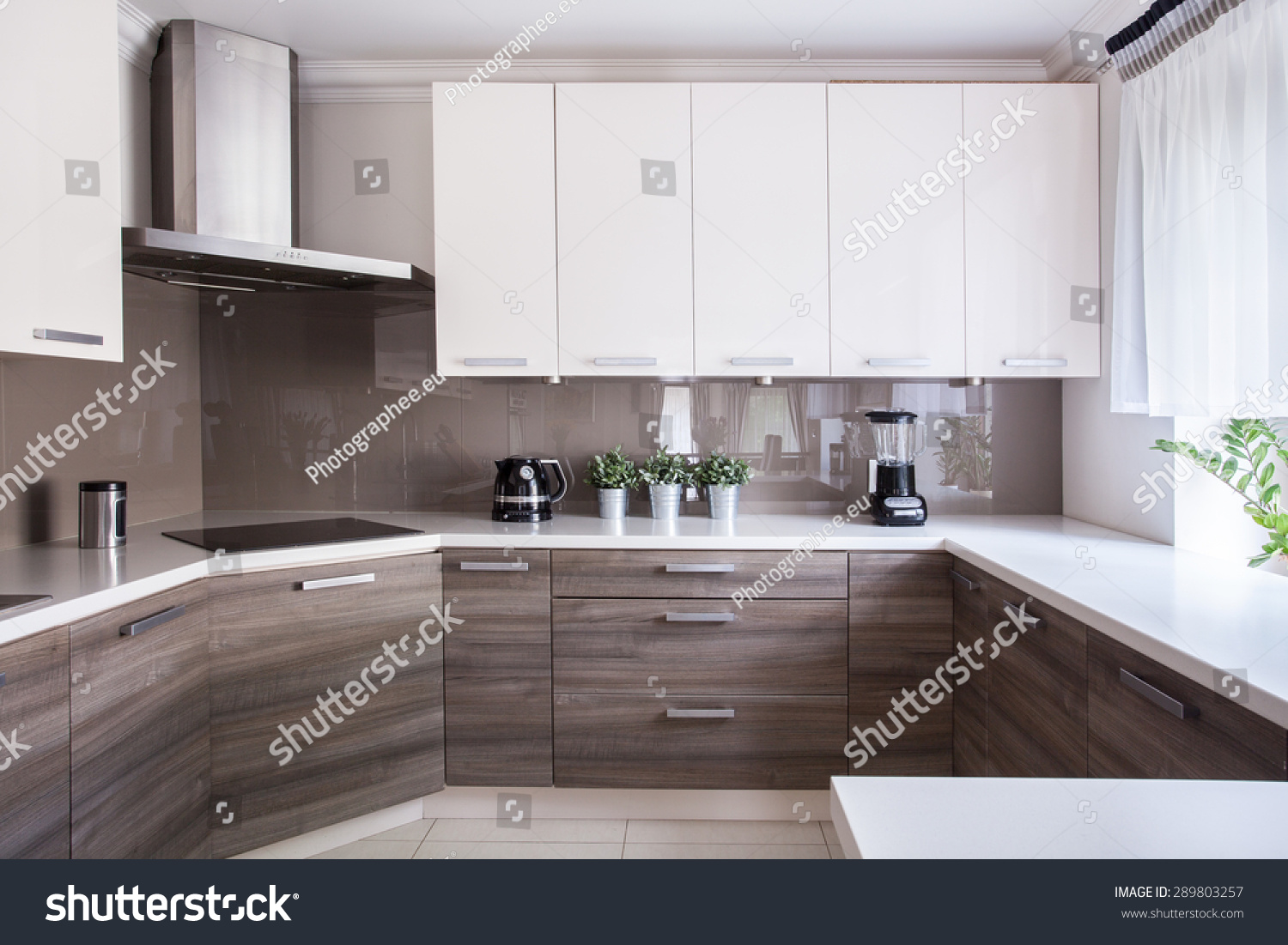 stock-photo-cozy-beige-kitchen-interior-with-wooden-cupboards-289803257.jpg