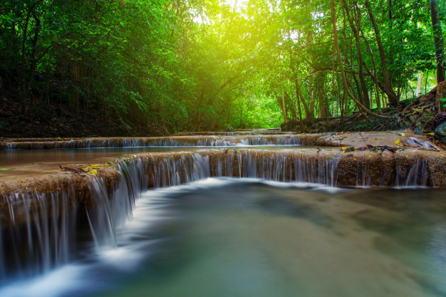 waterfall-with-tree-deep-forest-kanchanaburi-thailand_51195-1111.jpg