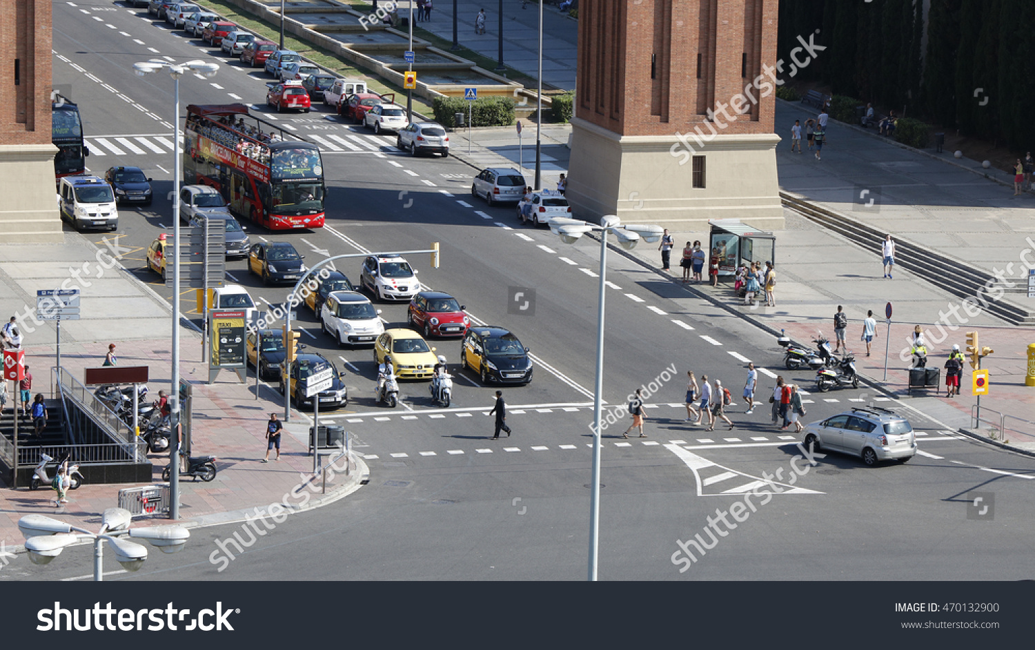 stock-photo-barcelona-traffic-cars-buses-and-pedestrians-on-a-sunny-day-spain-july-470132900.jpg